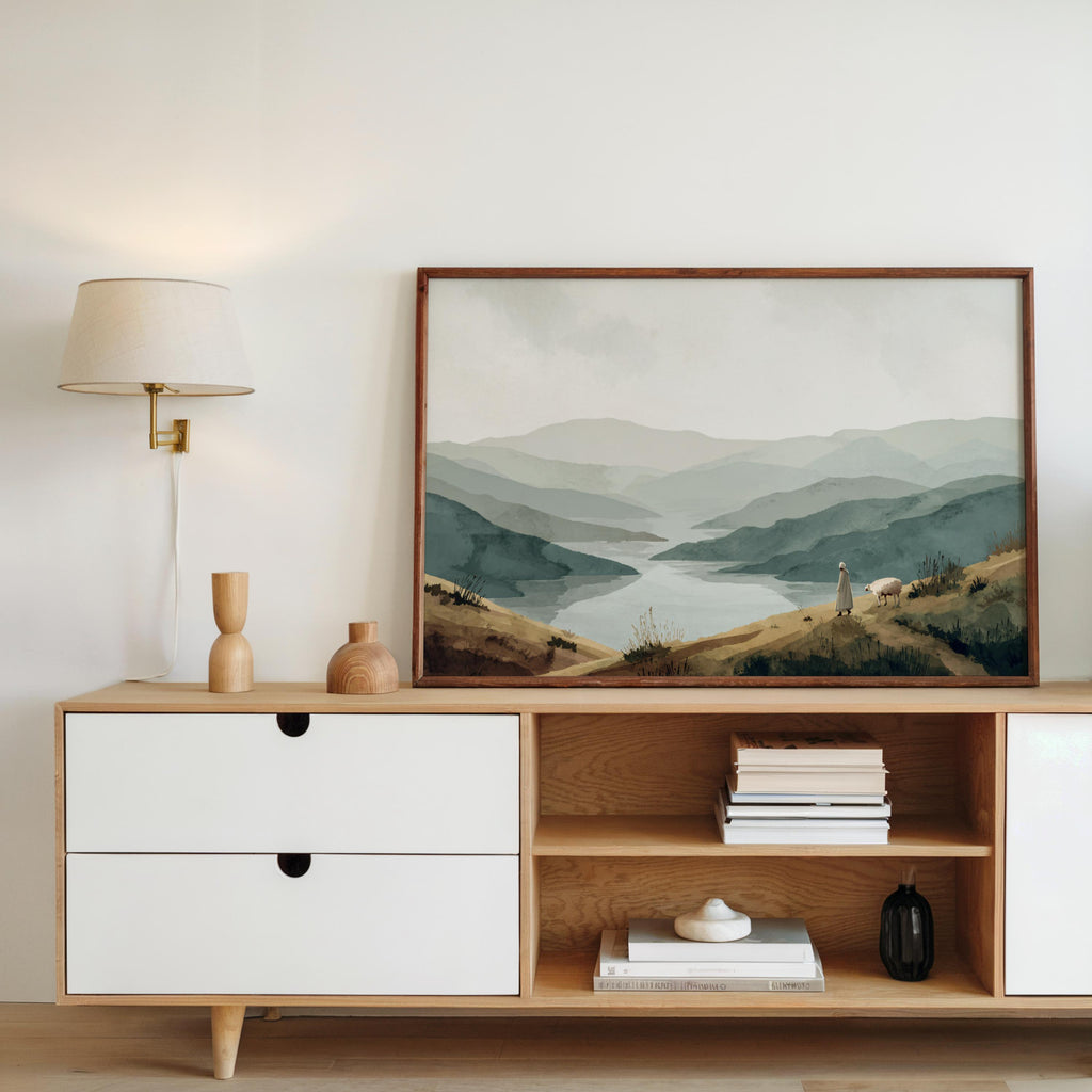 Framed Psalm 23 wall art print above Scandinavian console, warm wood, sage and dusty blue landscape tones