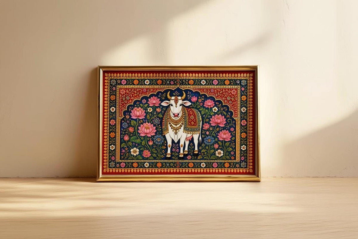 A framed painting of a cow, possibly a Hindu deity, is displayed on a wooden floor against a white wall.