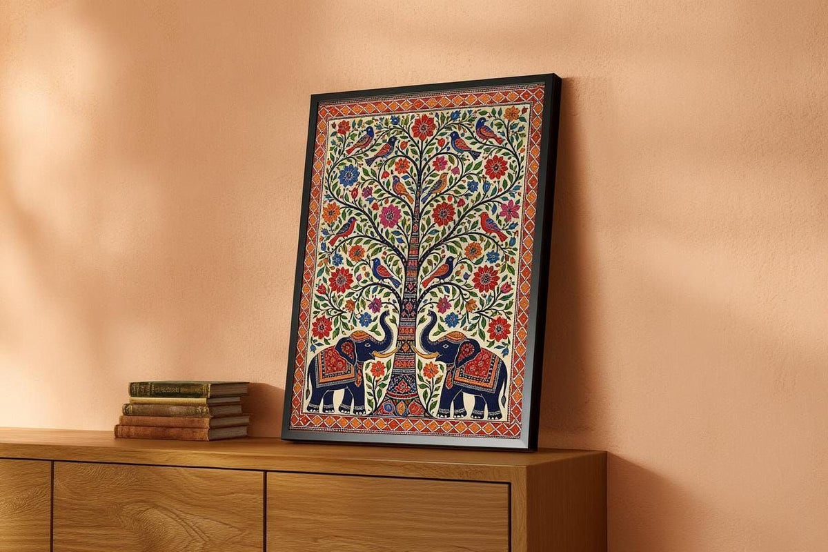 A framed picture of a colorful, intricate tree with elephants and birds is displayed on a wooden cabinet against a peach-colored wall.