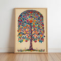 The image is a vibrant, colorful painting of a tree with a large, intricate design of flowers and leaves. The tree is the central focus of the artwork, which is displayed on a wall in a wooden frame.