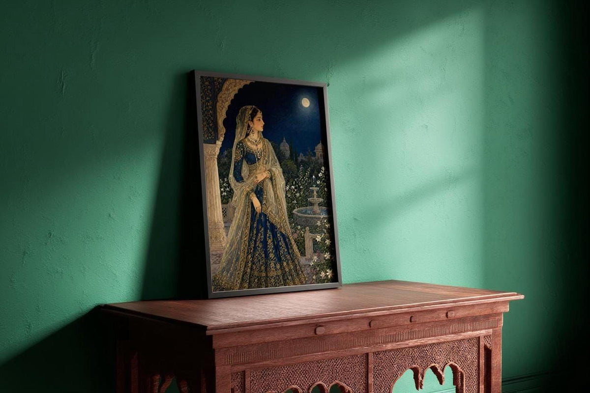 a framed painting of a woman in traditional Indian attire, standing in a room with a green wall and a wooden table.