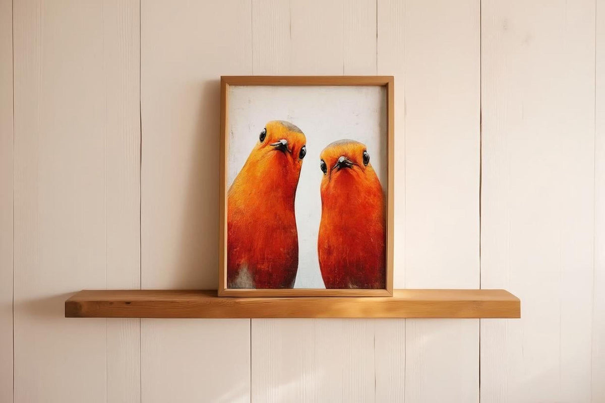 two vibrant orange birds standing side by side, with their heads turned towards the viewer.