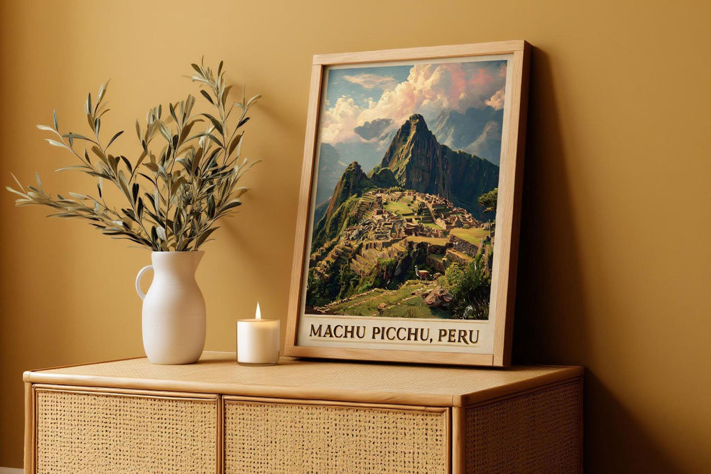 a framed poster of Machu Picchu, Peru, displayed on a wooden cabinet or shelf. Next to the poster, there is a white vase with green leaves and a lit candle, creating a cozy and inviting atmosphere.