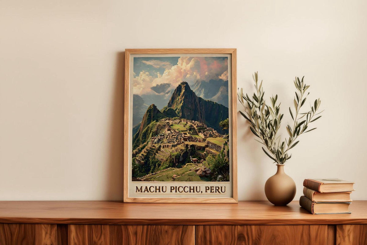 a framed poster of Machu Picchu, Peru, displayed on a wooden shelf next to a stack of books and a vase with greenery.