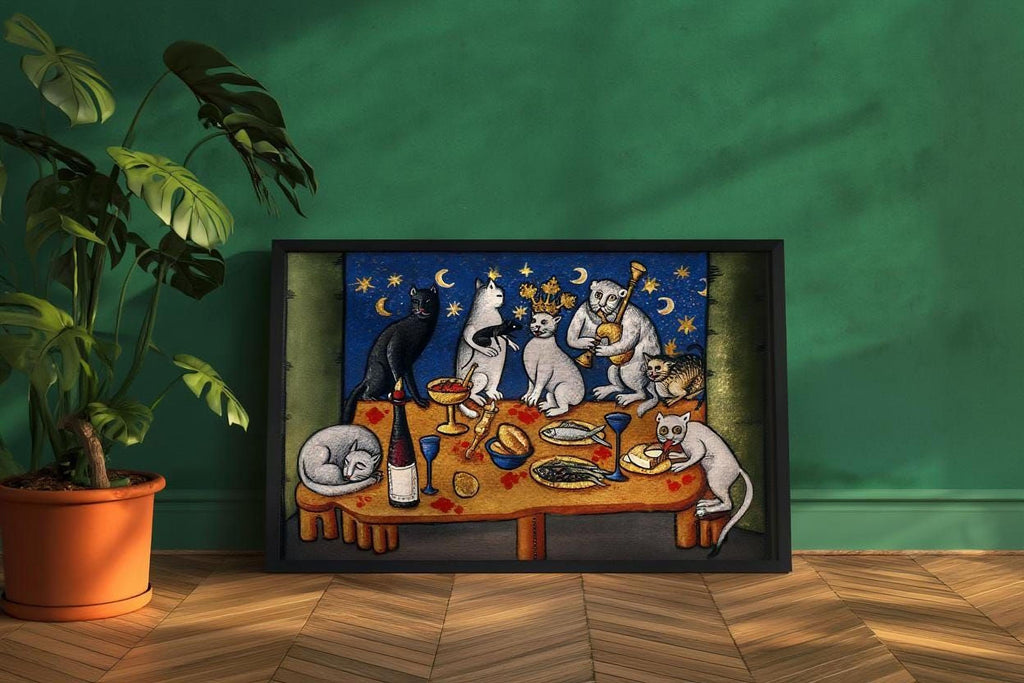 a framed painting depicting a whimsical scene of cats gathered around a table, enjoying a meal together under a starry night sky.