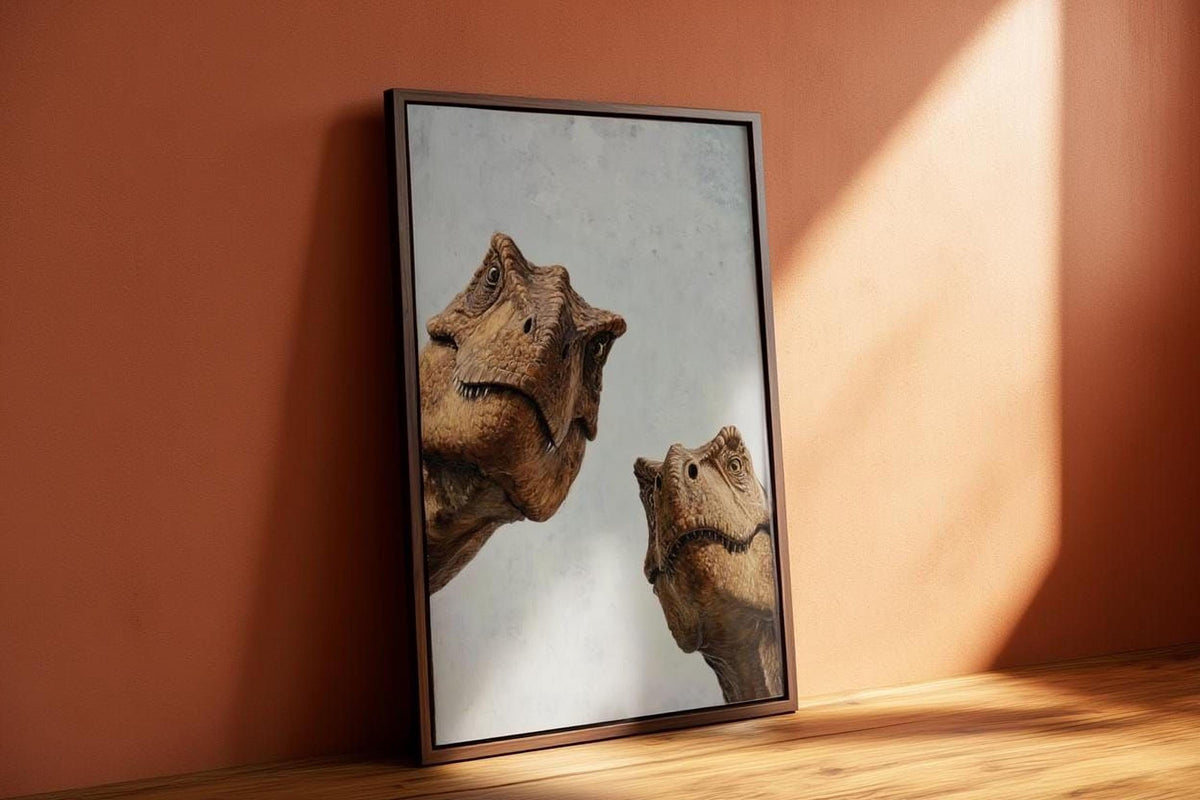 A framed image of two T-Rex dinosaurs, with one appearing larger than the other, is leaning against a wall.