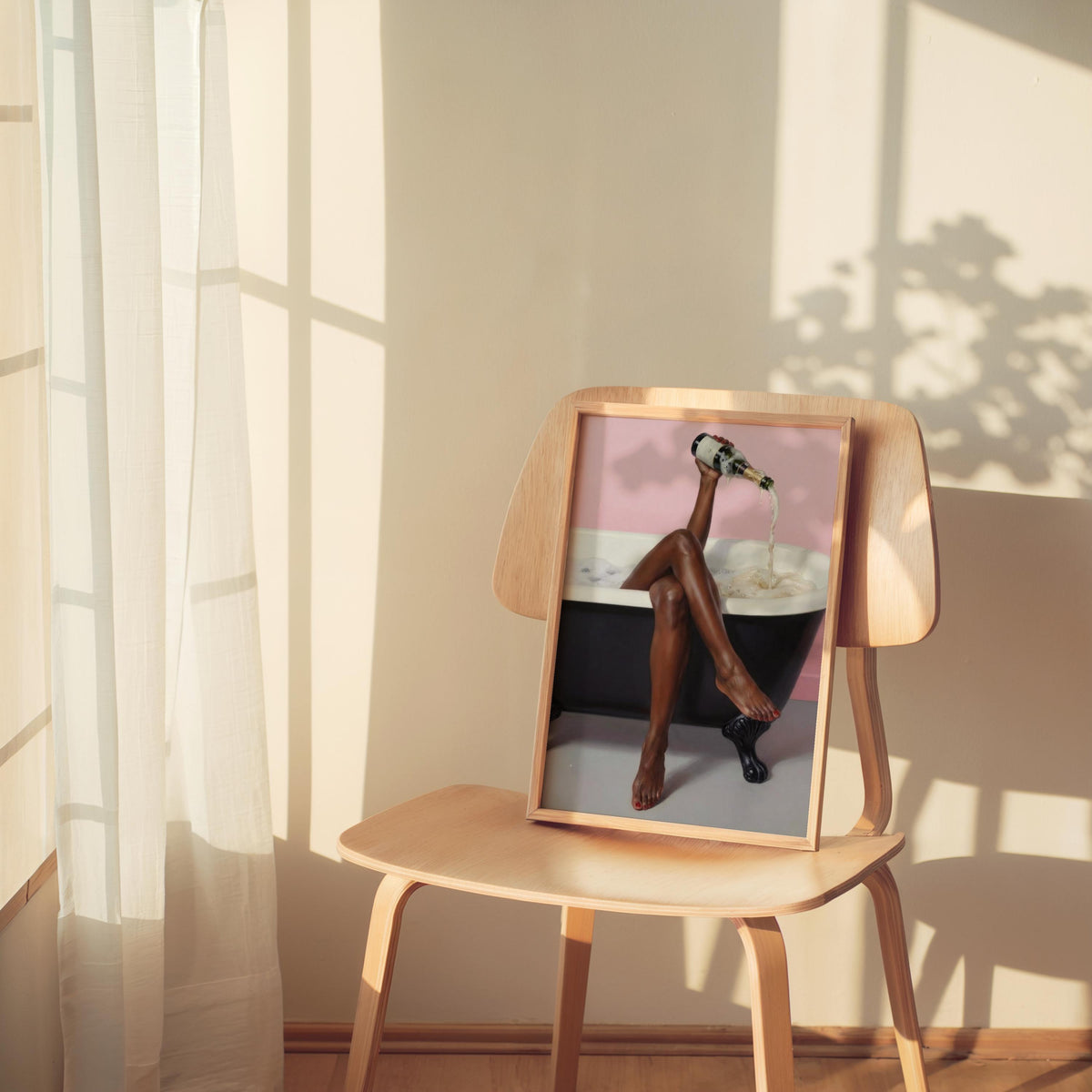 Print perched on a chair in warm window light, self care bathroom wall art, black woman bathroom wall art