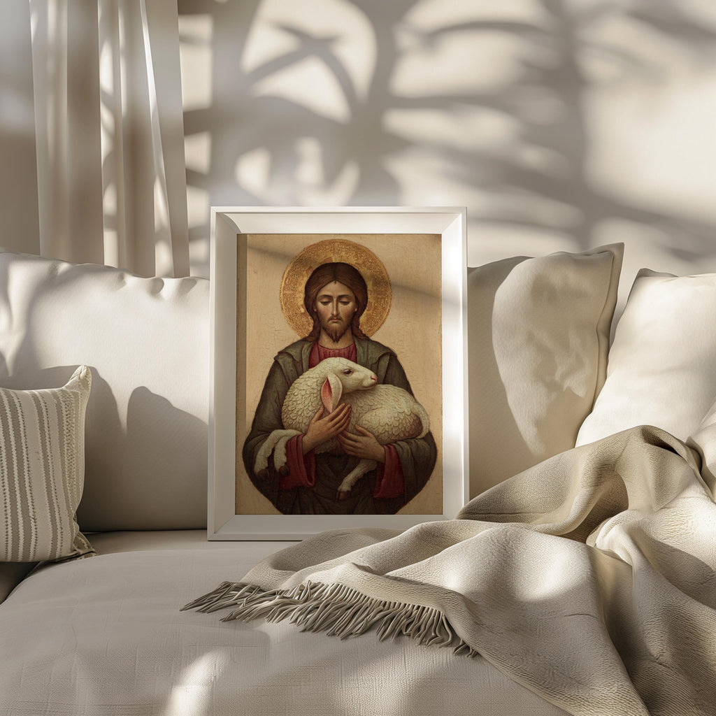 A framed painting of Jesus Christ holding a lamb is displayed on a white couch, with a striped pillow to the left and a beige blanket to the right.