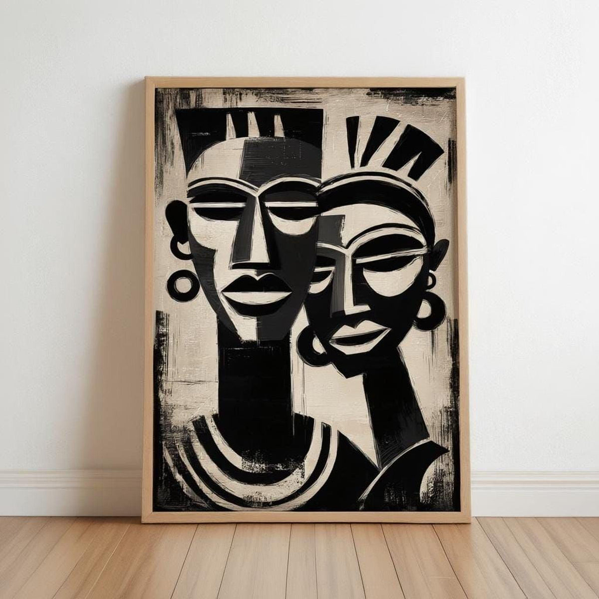 The image is a framed painting depicting two stylized human faces in a black and white color scheme.