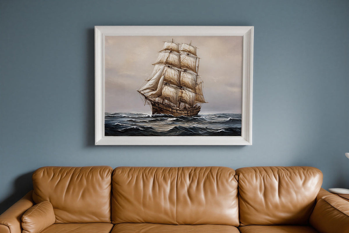 Antique tall ship canvas for nautical wall art; billowing sails on a moody navy blue seascape framed in ornate gold.