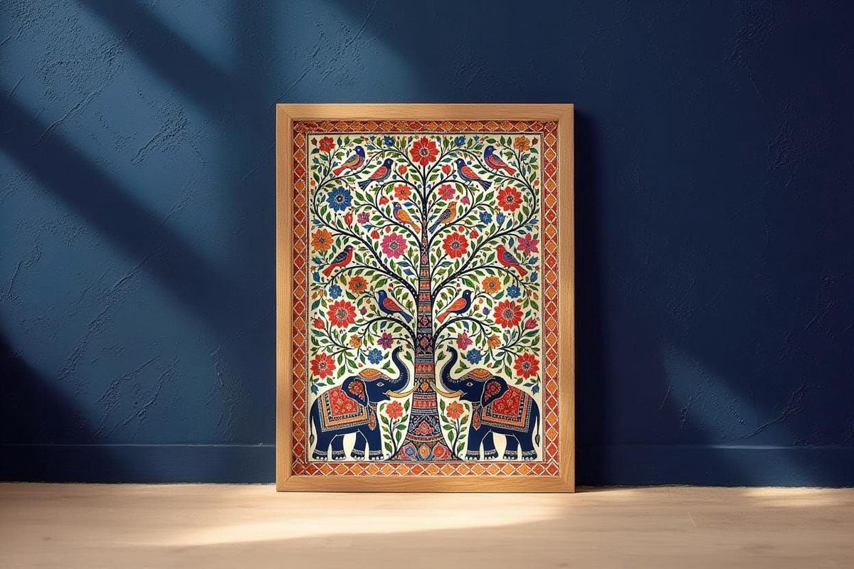 A framed painting of a tree with intricate floral designs and two elephants is displayed against a blue wall.