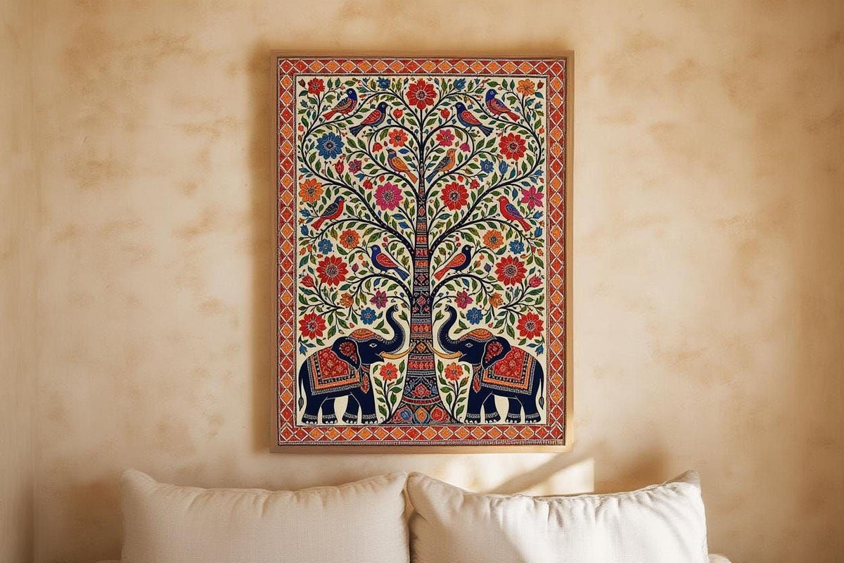 a vibrant, colorful painting of two elephants standing under a tree, with intricate patterns and designs surrounding them. The painting is displayed on a wall above a bed with white pillows.