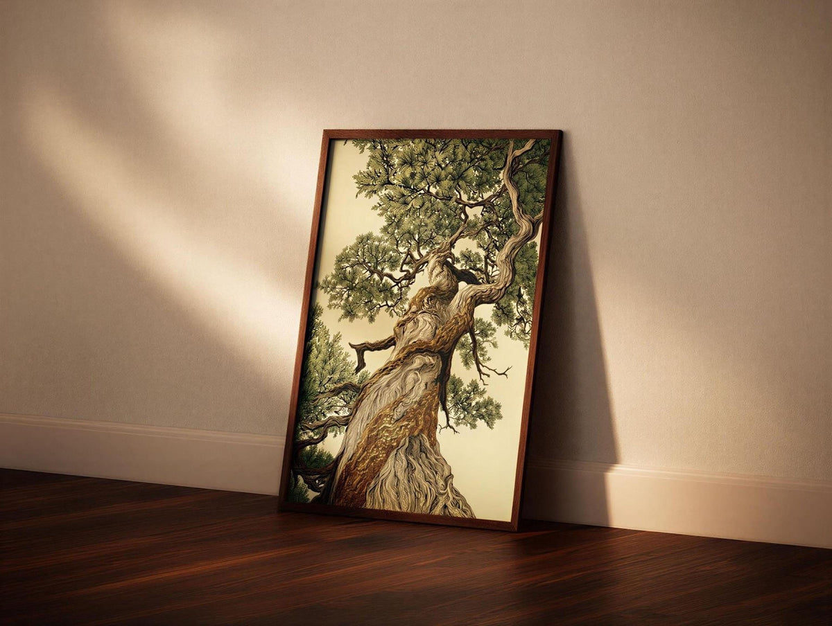 A framed painting of a large, twisted tree with a gnarled trunk and lush green foliage is displayed on a wooden floor against a plain white wall.