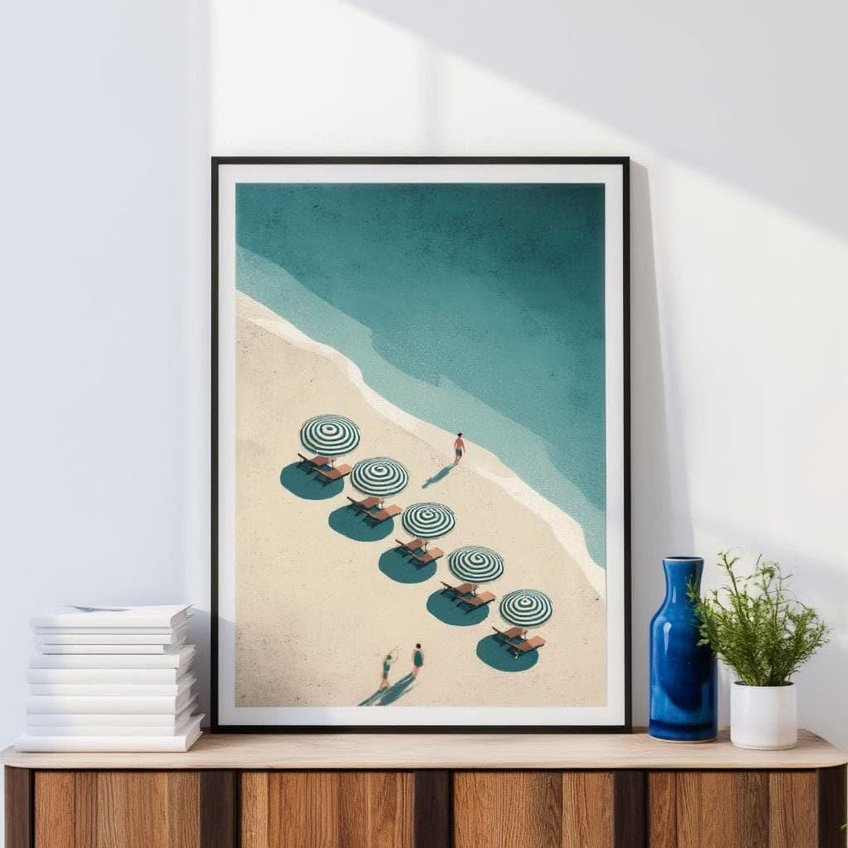 a beach scene with a row of striped umbrellas on the sand, and a person walking along the beach.