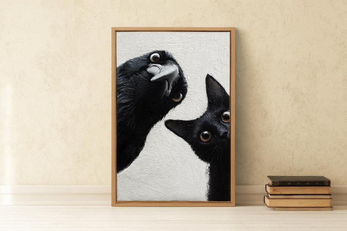 A framed photograph of a black cat peeking out from behind a black bird, with the cat's head tilted upwards and the bird's head tilted downwards, creating a playful and curious scene.