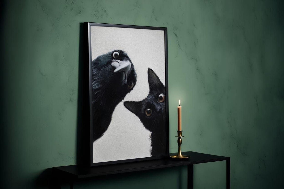 a black cat peeking out from behind a framed picture, with a lit candle on a black table next to the picture.