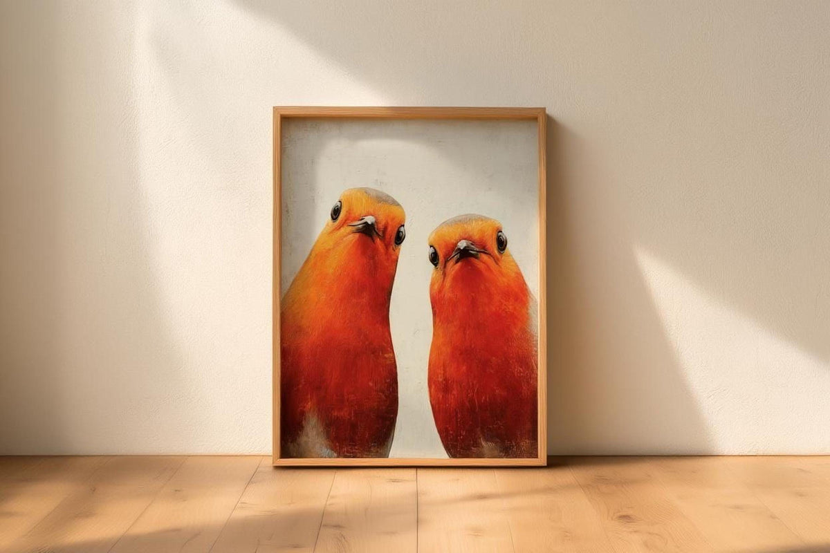 two vibrant red birds standing side by side, with their beaks open and their eyes focused on the camera.