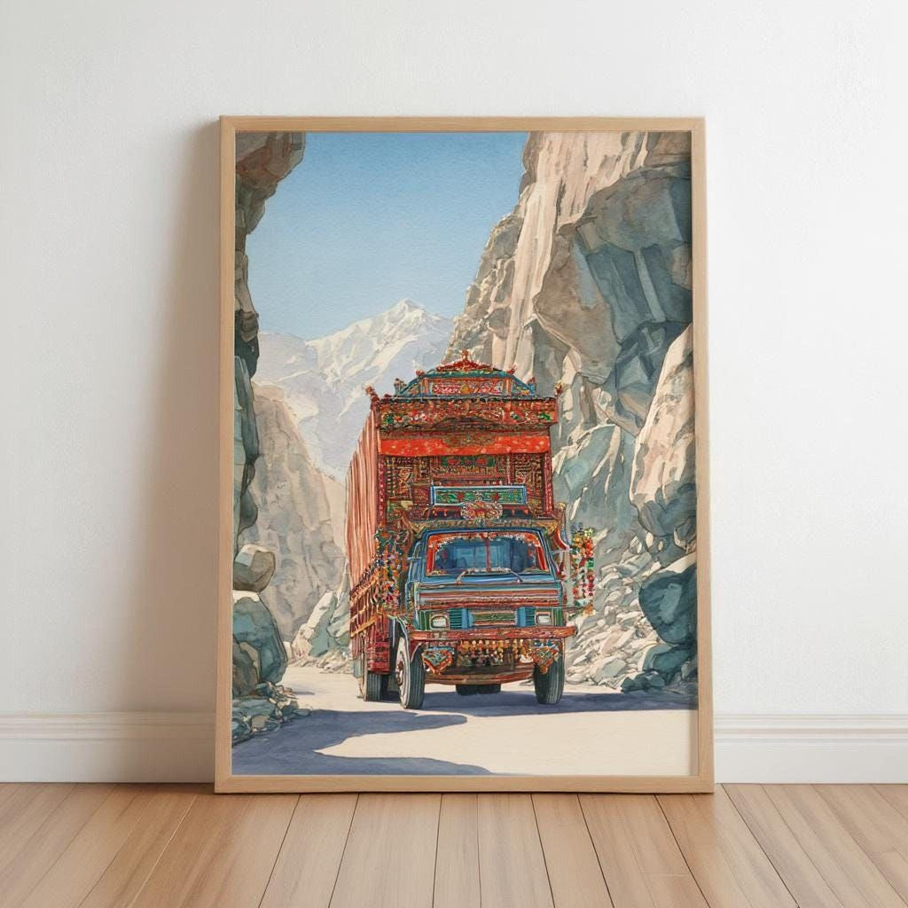 A colorful and intricately decorated truck is driving down a narrow mountain road, surrounded by rocky cliffs and a clear blue sky.