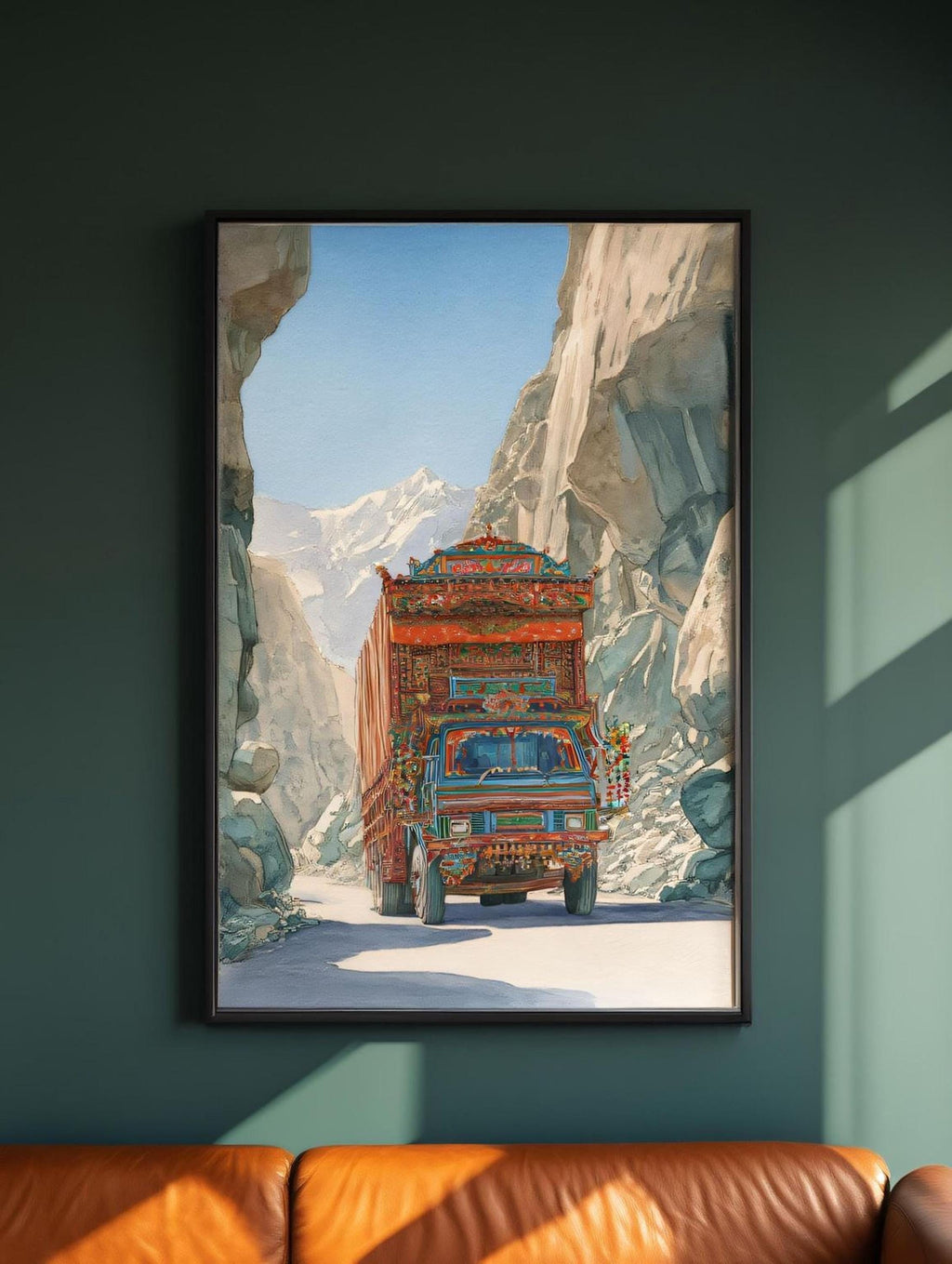 a colorful truck driving through a mountainous landscape, with a clear blue sky and snow-capped peaks in the background.