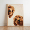 two brown dogs peeking out from behind a wooden frame.