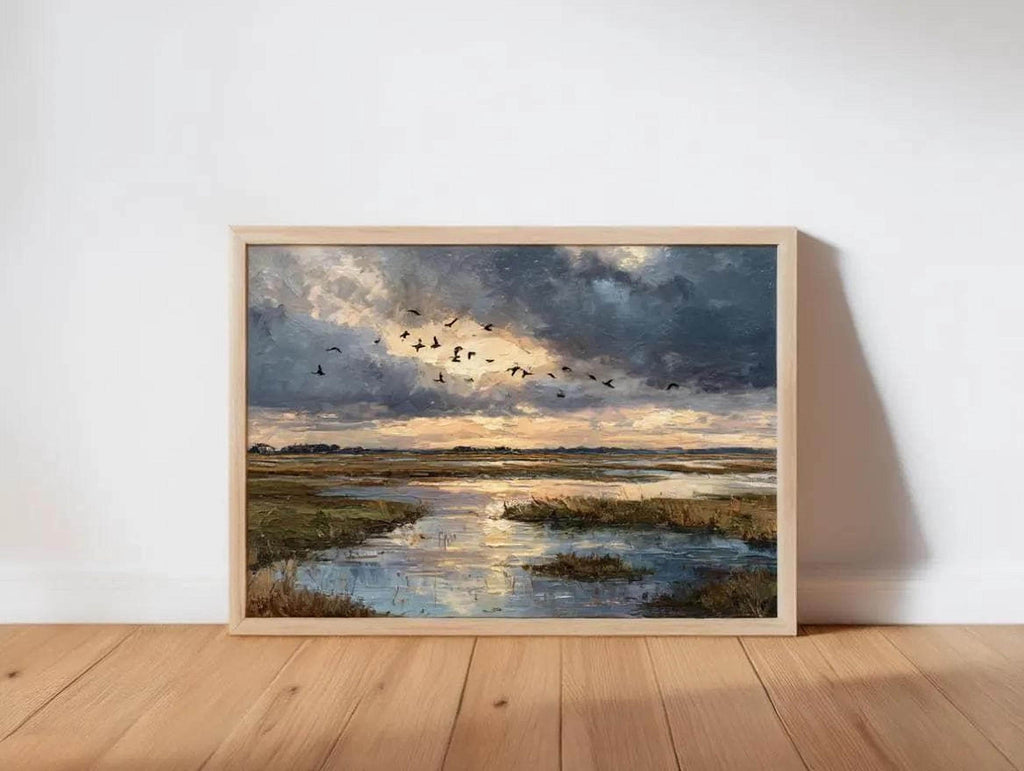 The image is a framed painting depicting a serene landscape with a river, birds flying in the sky, and a cloudy, colorful sky.