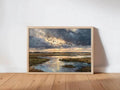 The image is a framed painting depicting a serene landscape with a river, birds flying in the sky, and a cloudy, colorful sky.