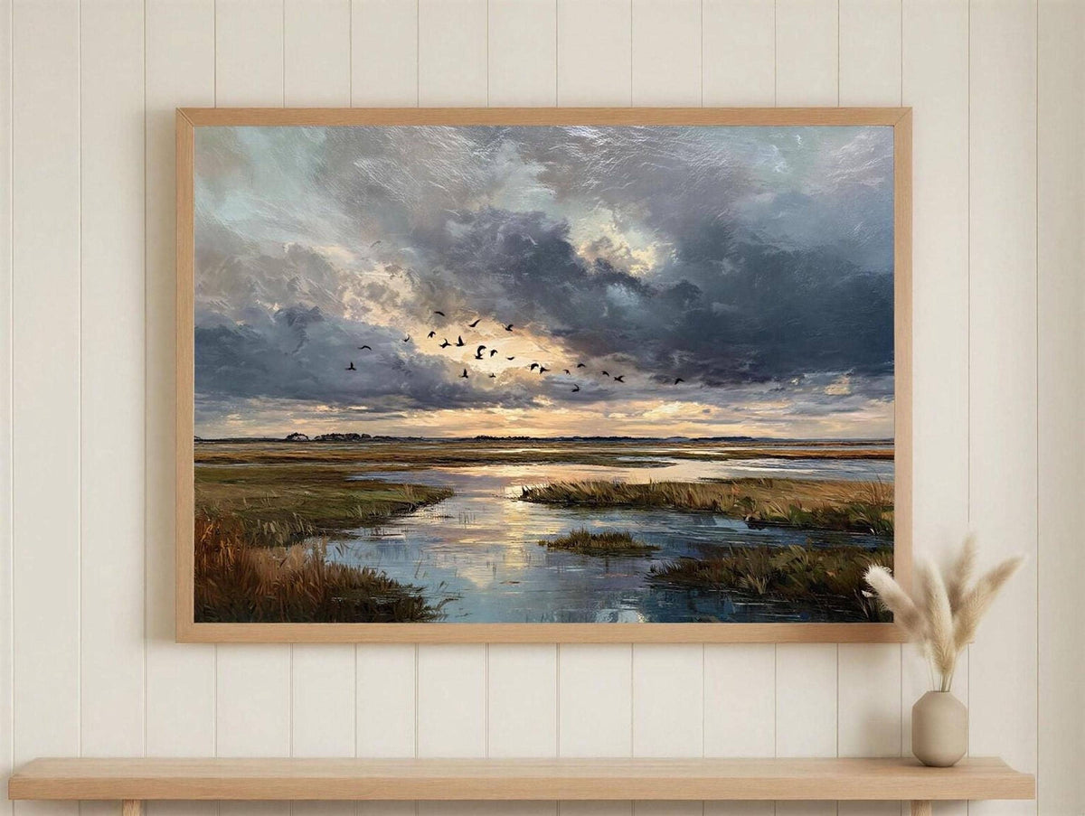 The image is a framed painting depicting a serene landscape with a river, birds flying in the sky, and a dramatic cloudy sky.