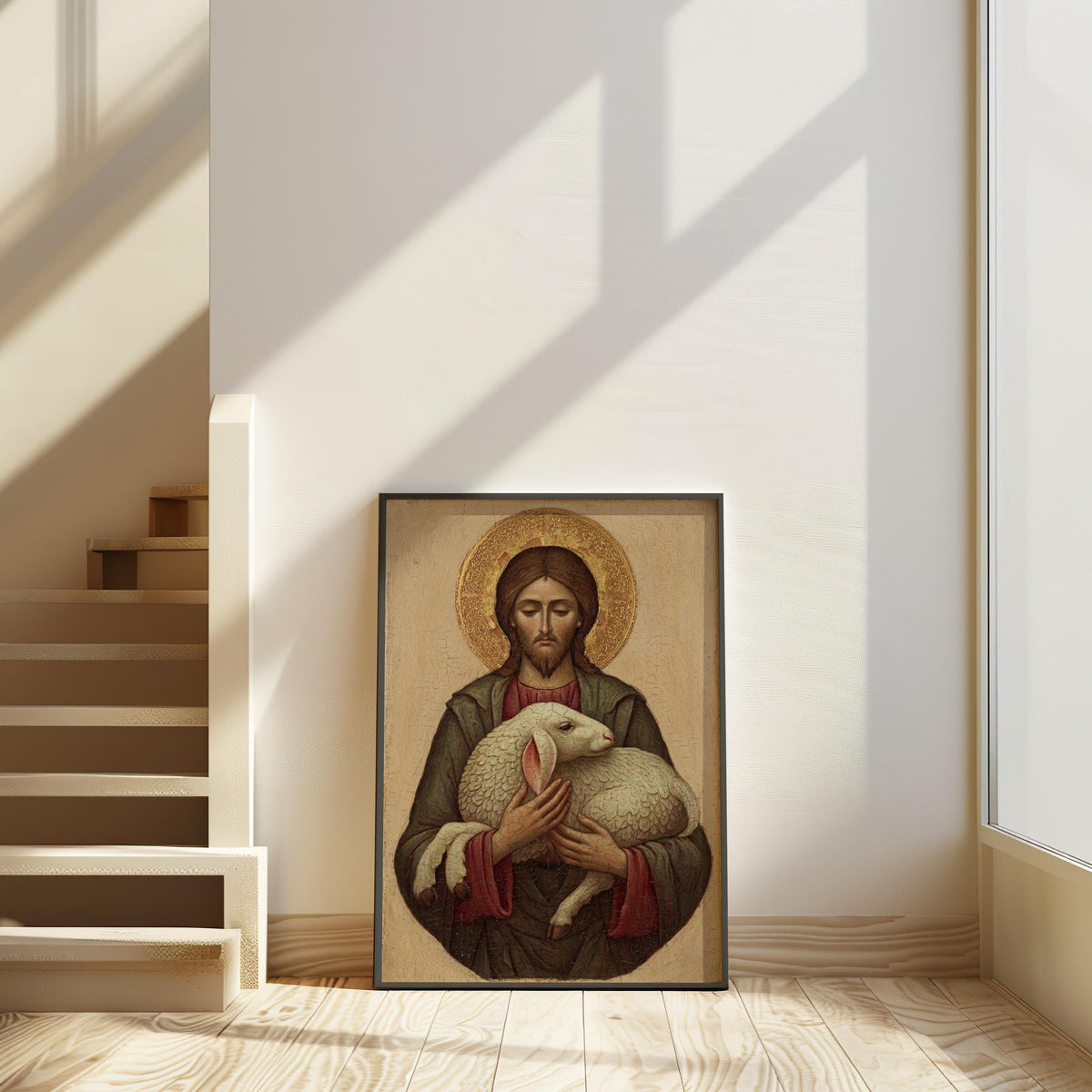 a framed painting of Jesus Christ holding a lamb, placed on a wooden floor in a room with a staircase visible in the background.