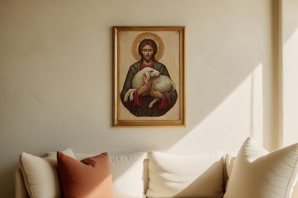 a framed painting of Jesus Christ holding a lamb, hanging on a wall above a white couch with a red pillow.