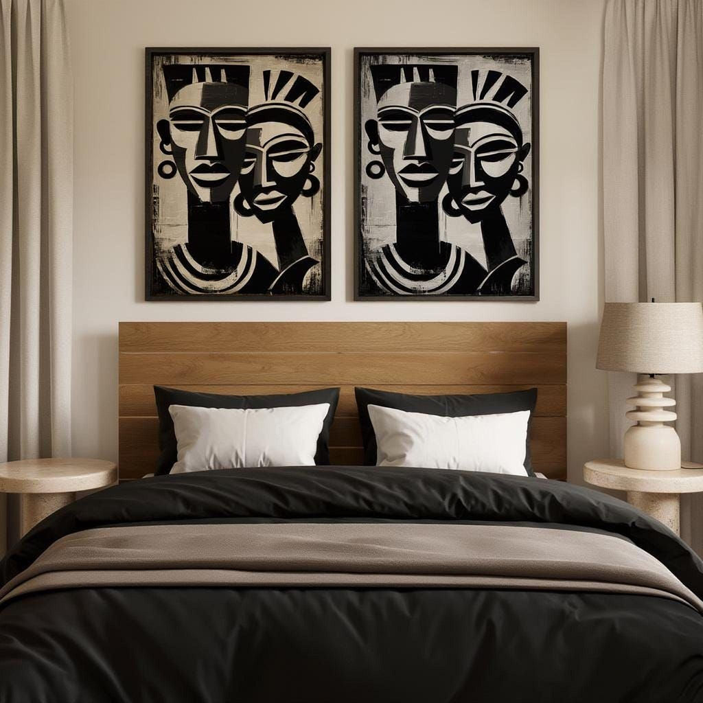 a bedroom with a bed, two framed abstract artworks on the wall above it, and a lamp on a side table.