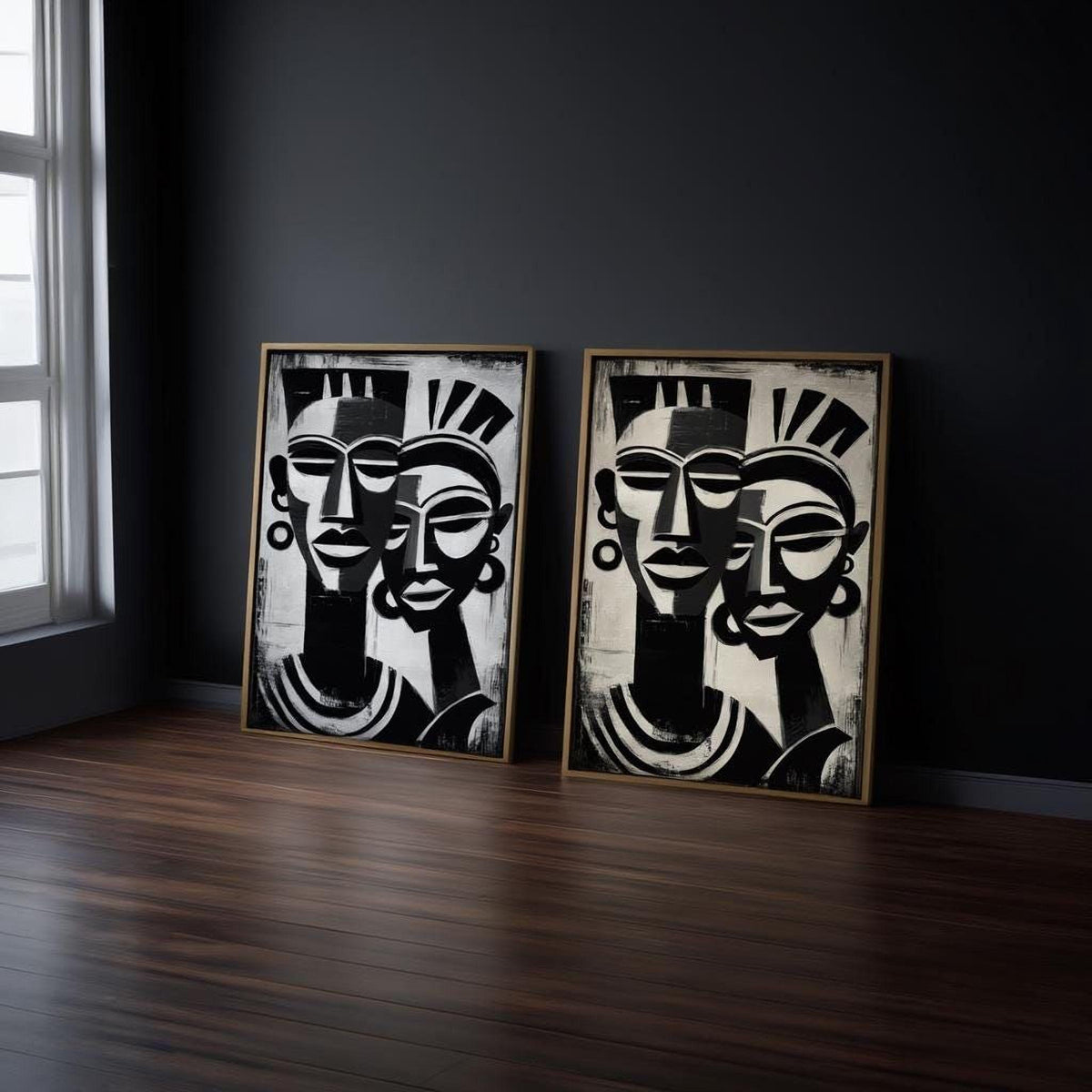 two framed artworks depicting abstract human faces in black and white.