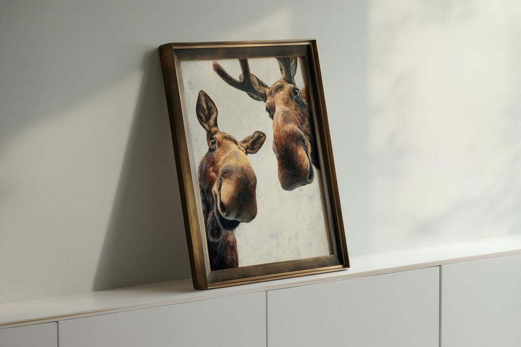 Dark framed moose print angled on a console, rich brushstrokes and rustic tones, modern farmhouse animal art, funny moose wall art printable