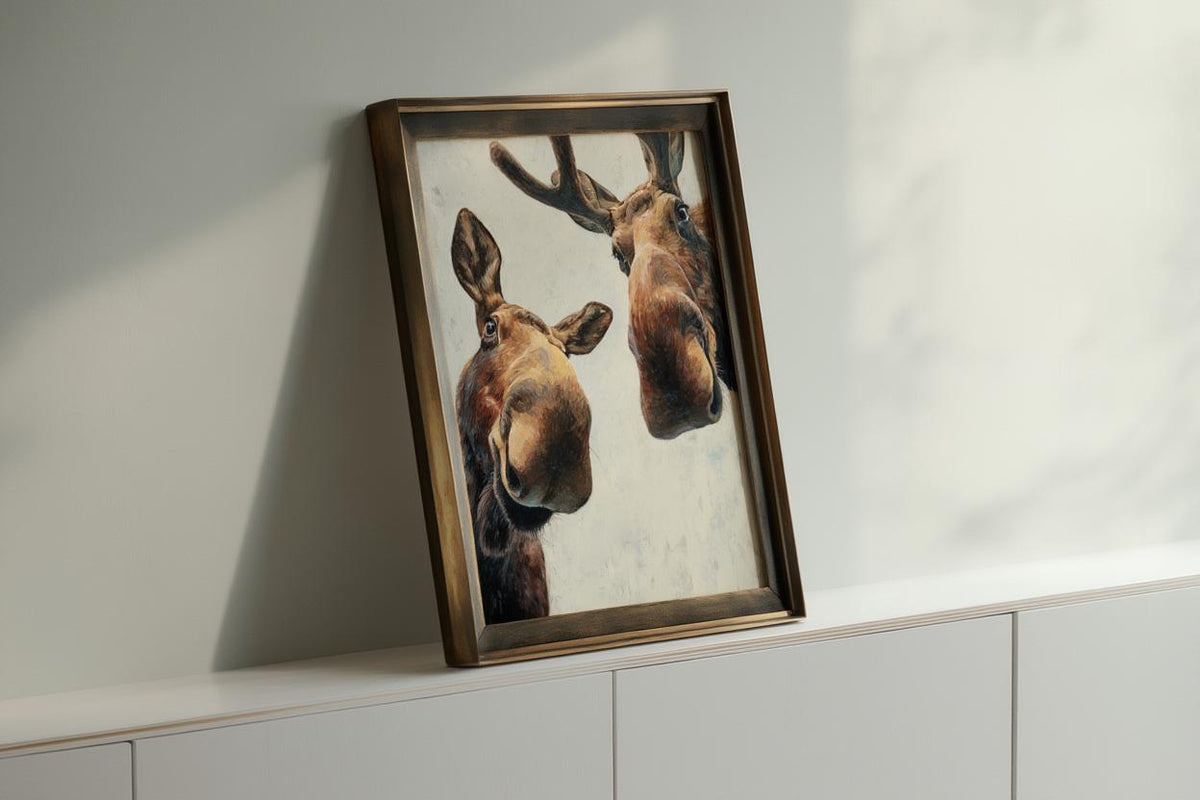 Dark framed moose print angled on a console, rich brushstrokes and rustic tones, modern farmhouse animal art, funny moose wall art printable