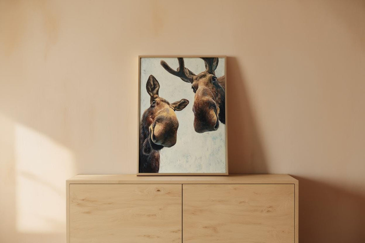 Moose art resting on a dresser in warm morning light, cozy nursery mockup vibe, playful wildlife art, funny moose wall art printable