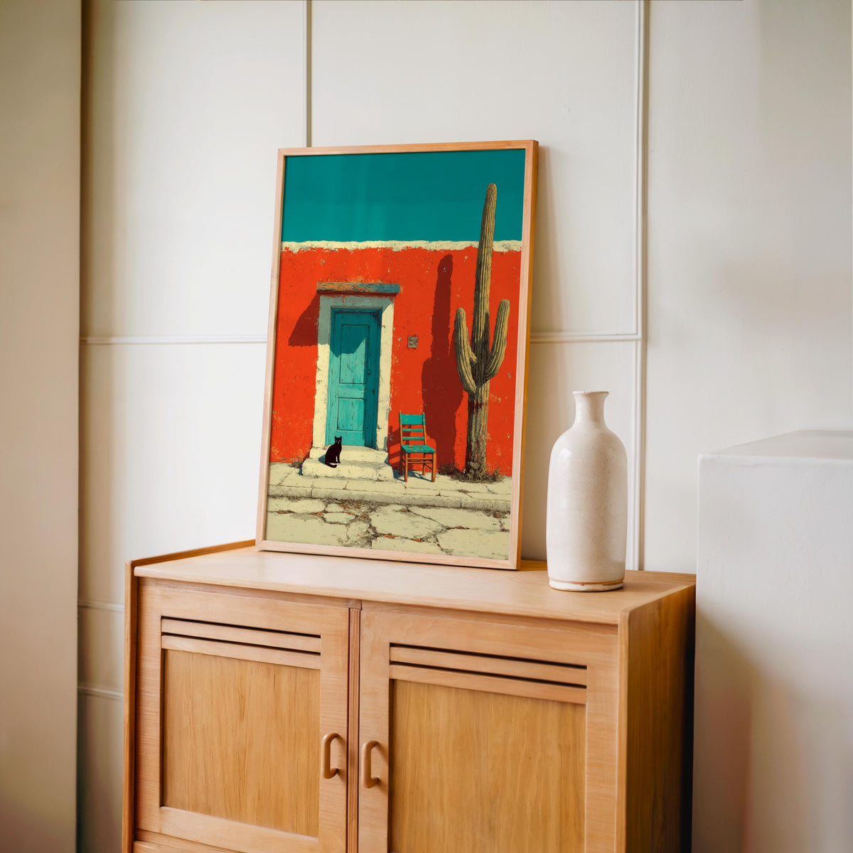 Colorful desert house poster displayed on a mid-century cabinet, modern colorful wall art with simple ceramic vase