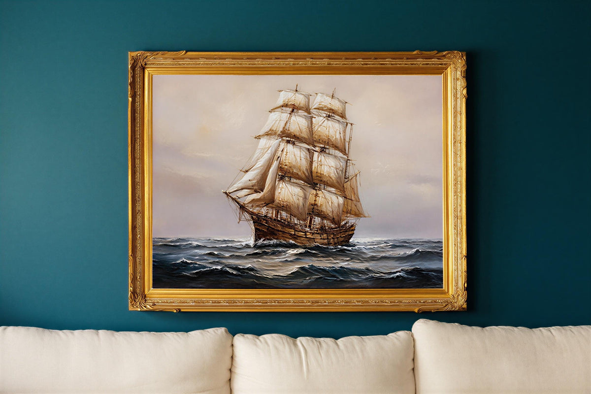 Antique tall ship canvas for nautical wall art; billowing sails on a moody navy blue seascape framed in ornate gold.