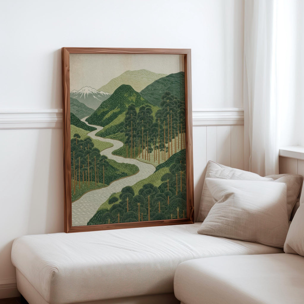 Cozy sofa corner with green mountain wall art leaning against wall, modern nature wall decor in a neutral room