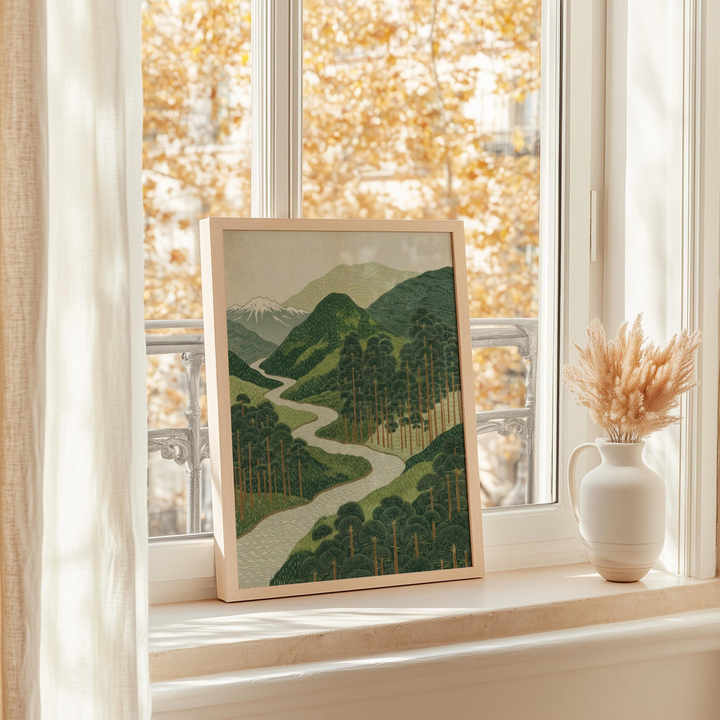 Framed green mountain wall art on a sunny windowsill, serene mountain art print with autumn outside