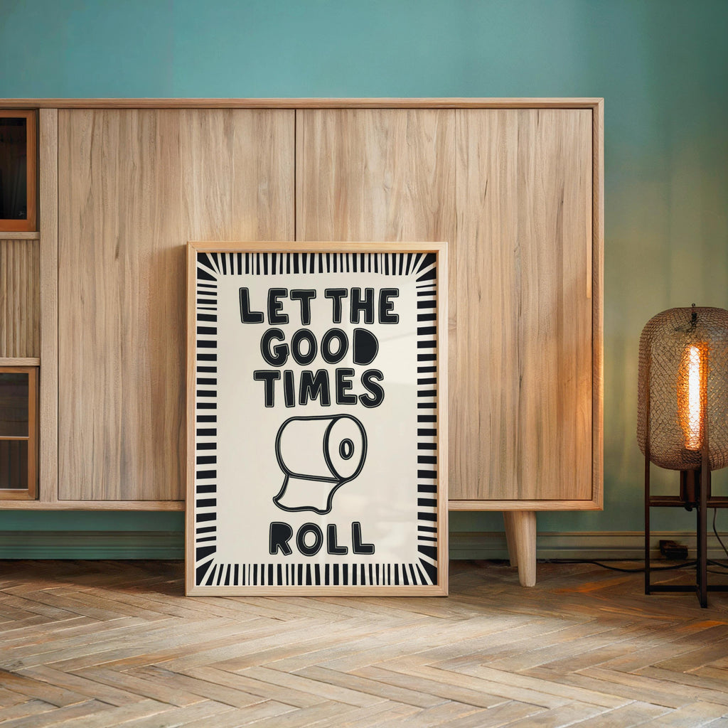 Monochrome poster propped against wood cabinet, bold retro typography, funny guest bathroom decor, restroom wall art