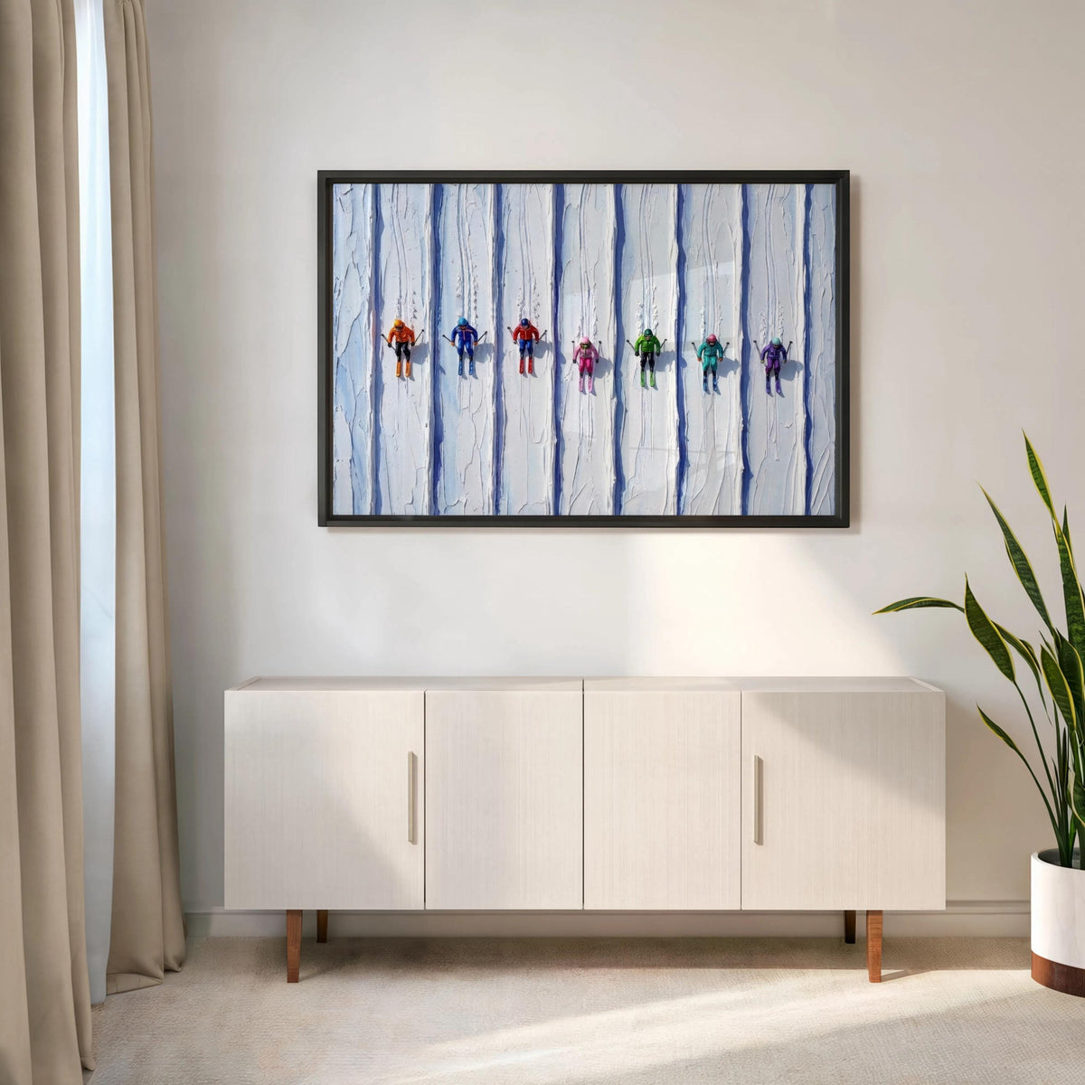 Black-framed vintage ski art print above a low credenza, minimalist retro ski decor accent