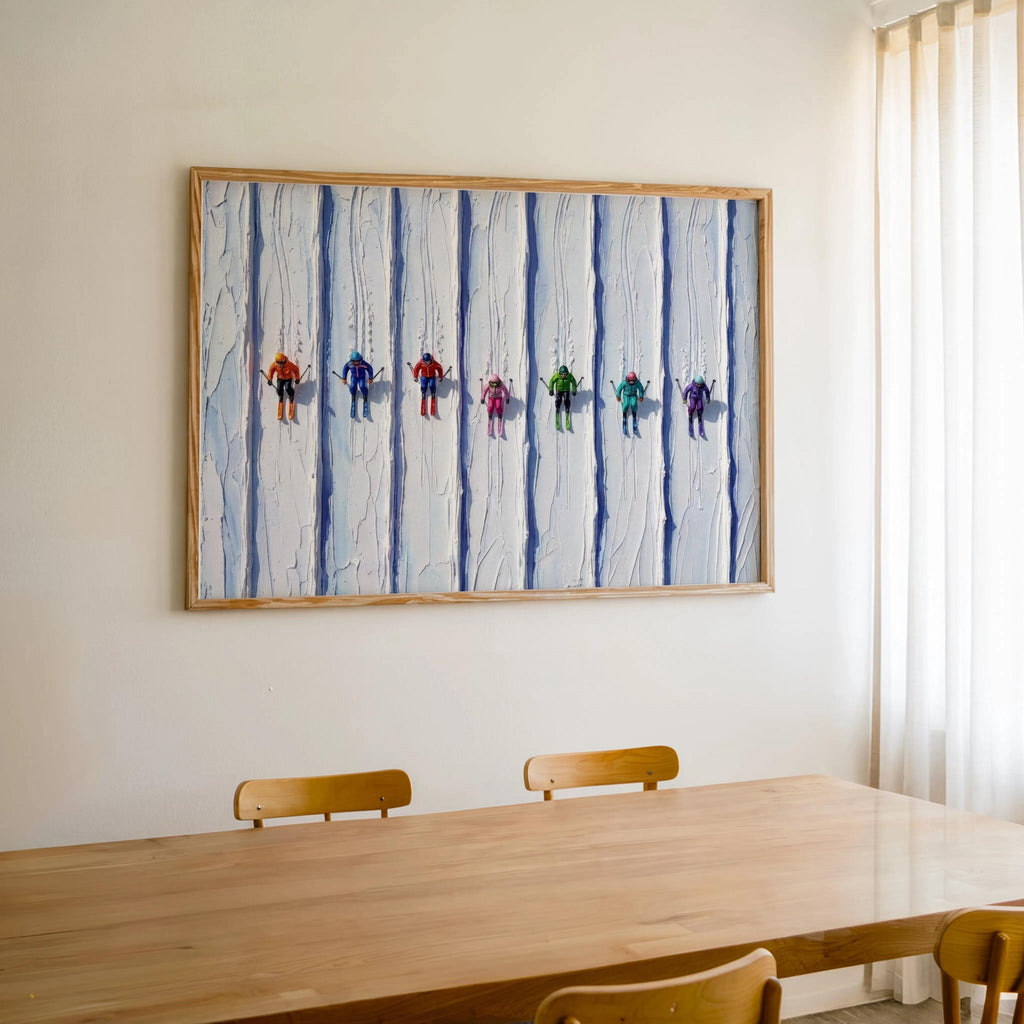 Vintage ski art print hung above Scandinavian dining table, colorful tiny skiers brighten the room