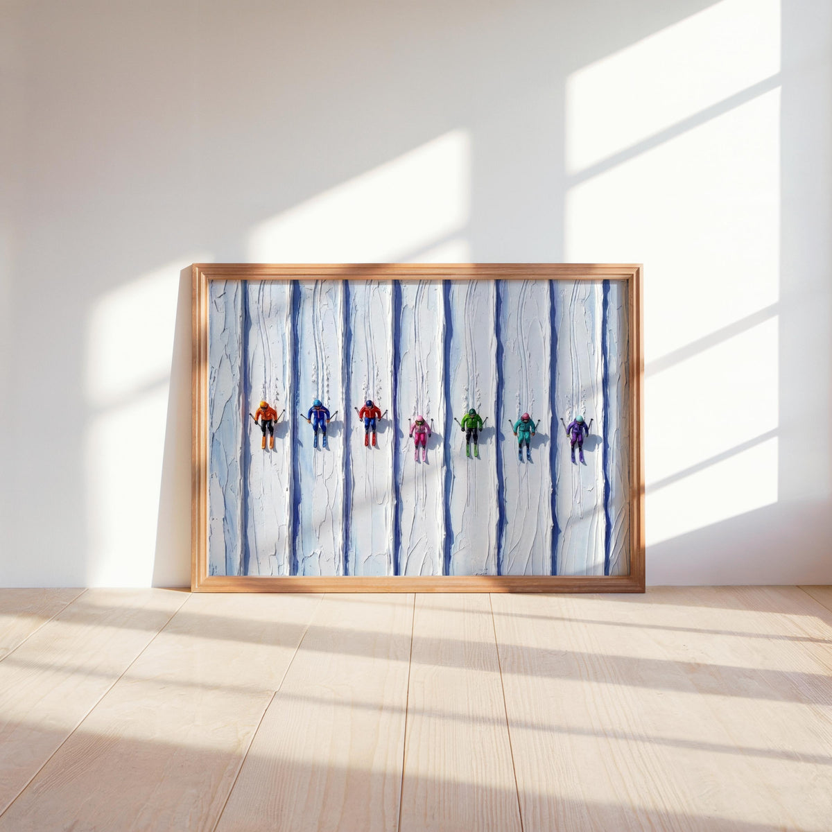 Small wood-framed vintage ski art print propped on sunlit floor, vertical icy ridges highlight color