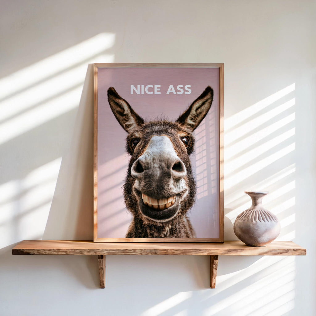 Dusty rose funny donkey bathroom sign propped against wall, expressive ears and grin, quirky housewarming bathroom gift