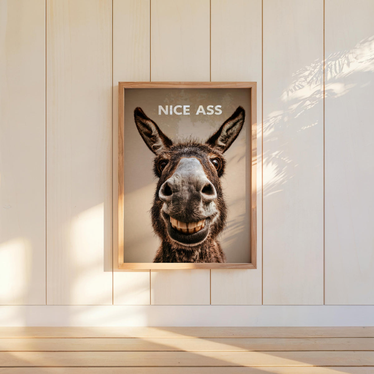 Neutral toned donkey bathroom print hung on shiplap, smiling donkey, modern rustic cheeky restroom decor