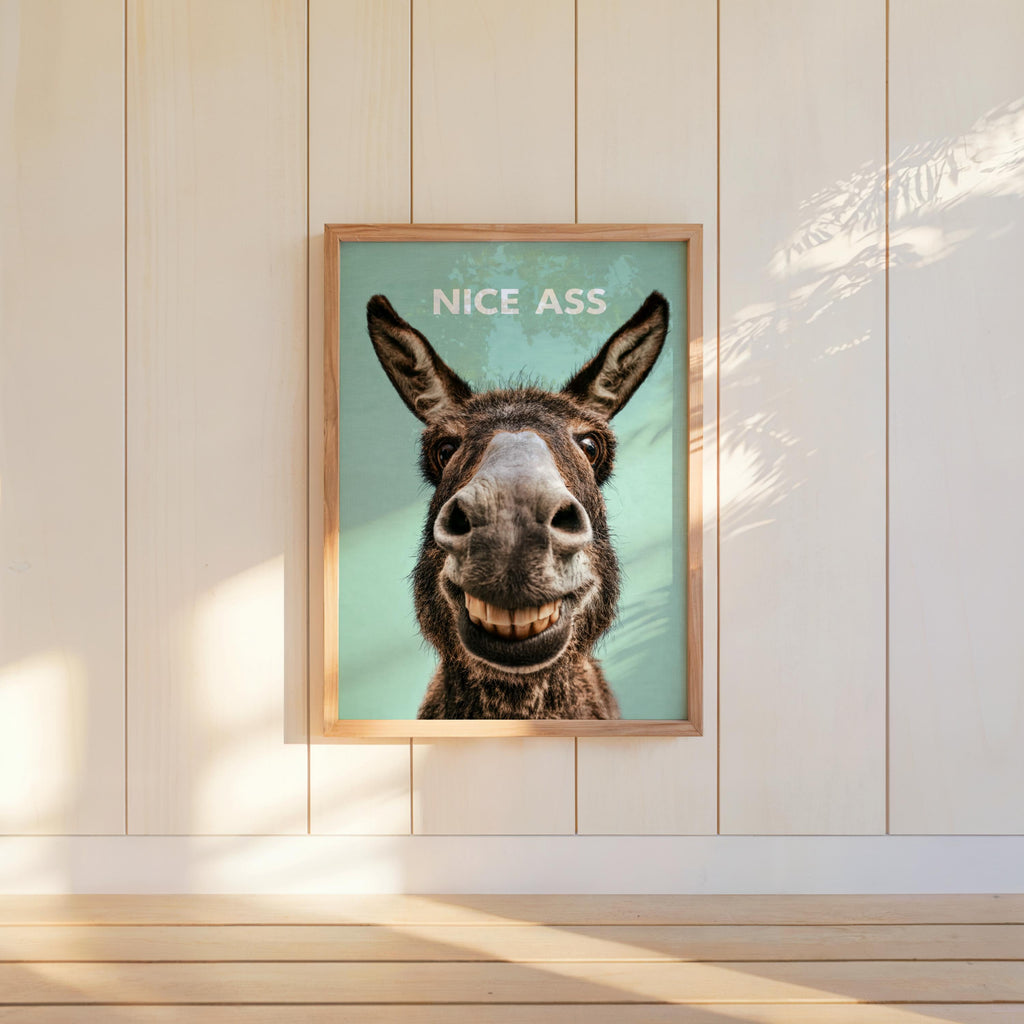 Minty green funny donkey bathroom sign centered on paneled wall, toothy donkey smile, nice ass print style