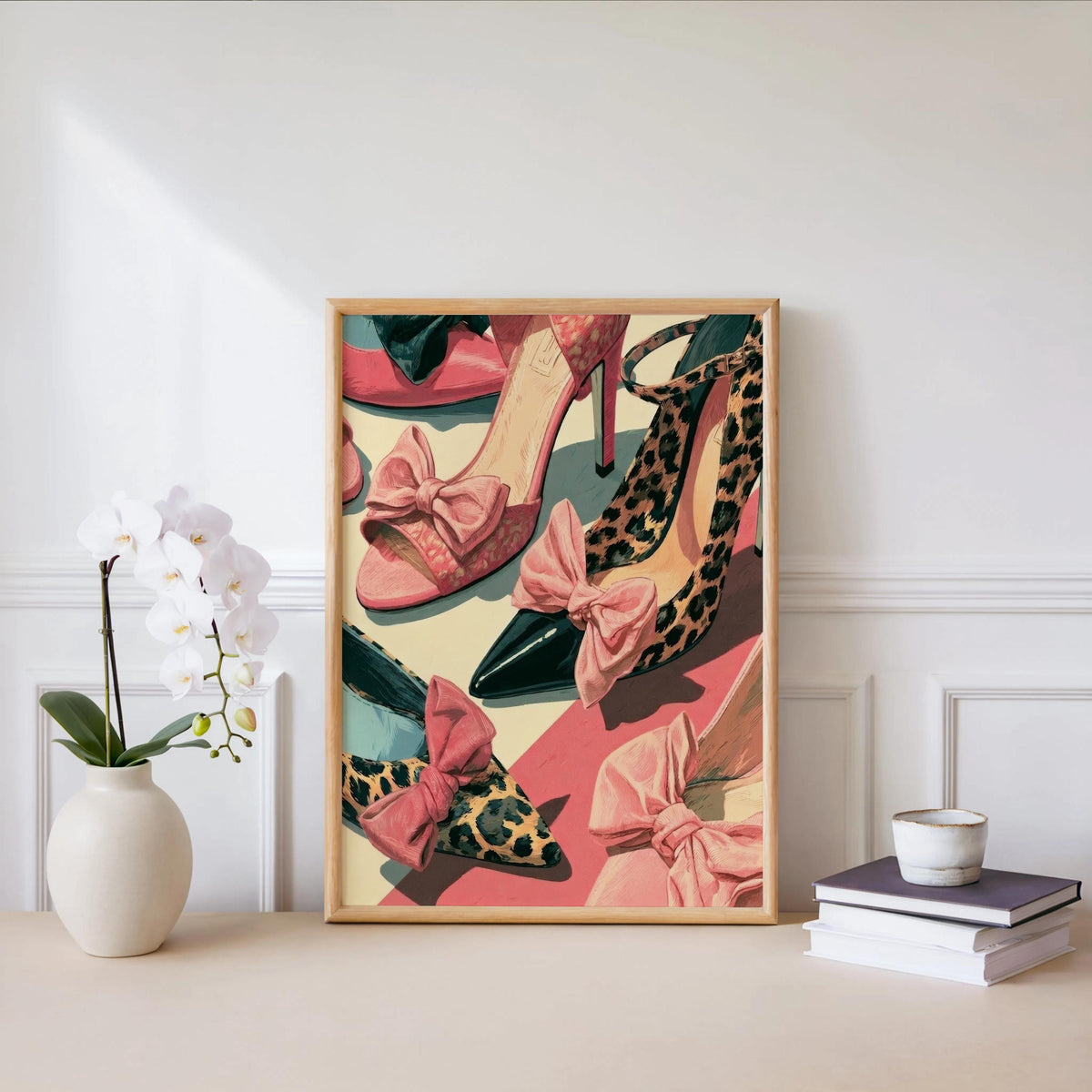 Pink high heels poster beside a white orchid and books on a console, soft neutrals, dressing room wall decor appeal