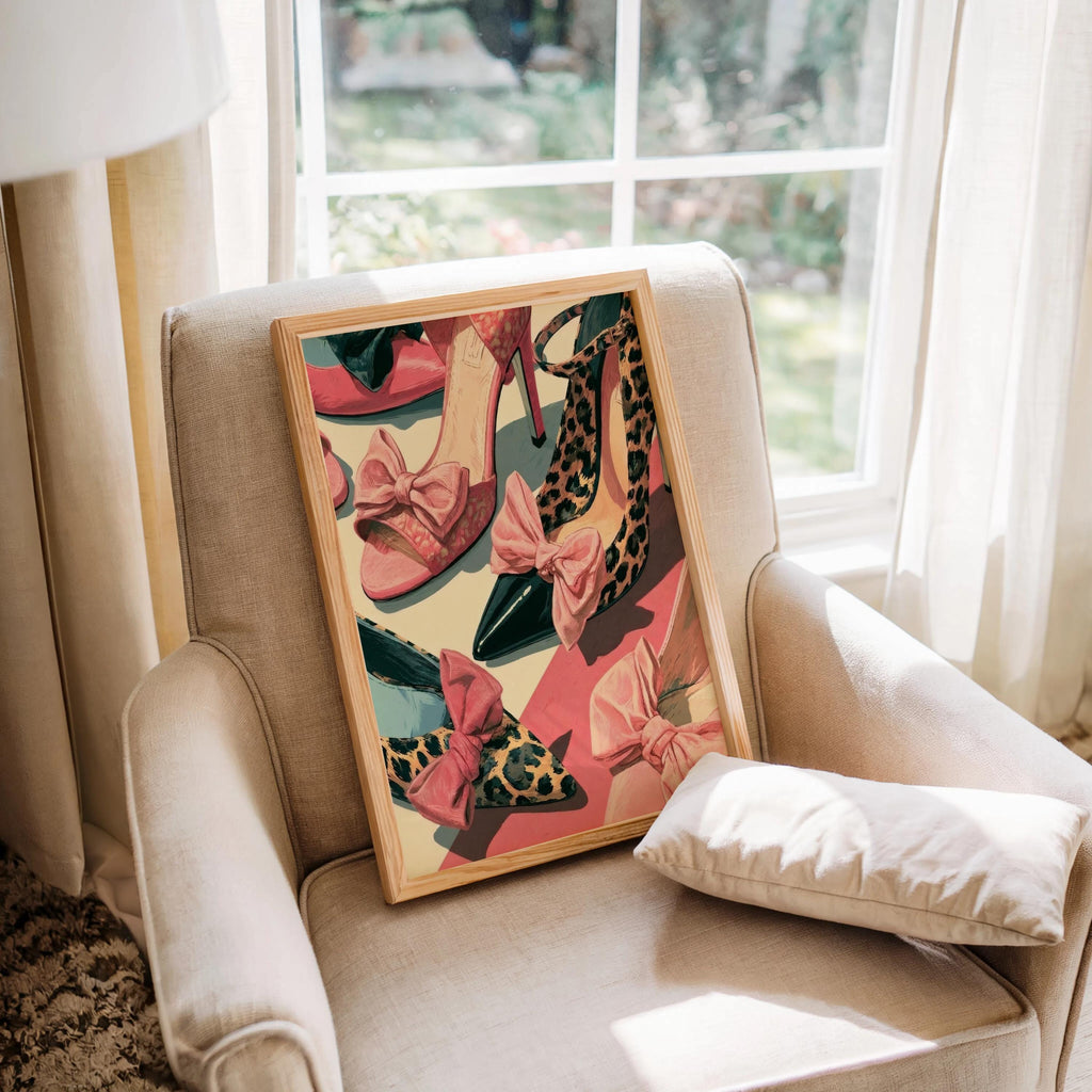 Girly fashion wall art displayed on a cozy armchair by a window, textured cushion, floral pink and leopard heels