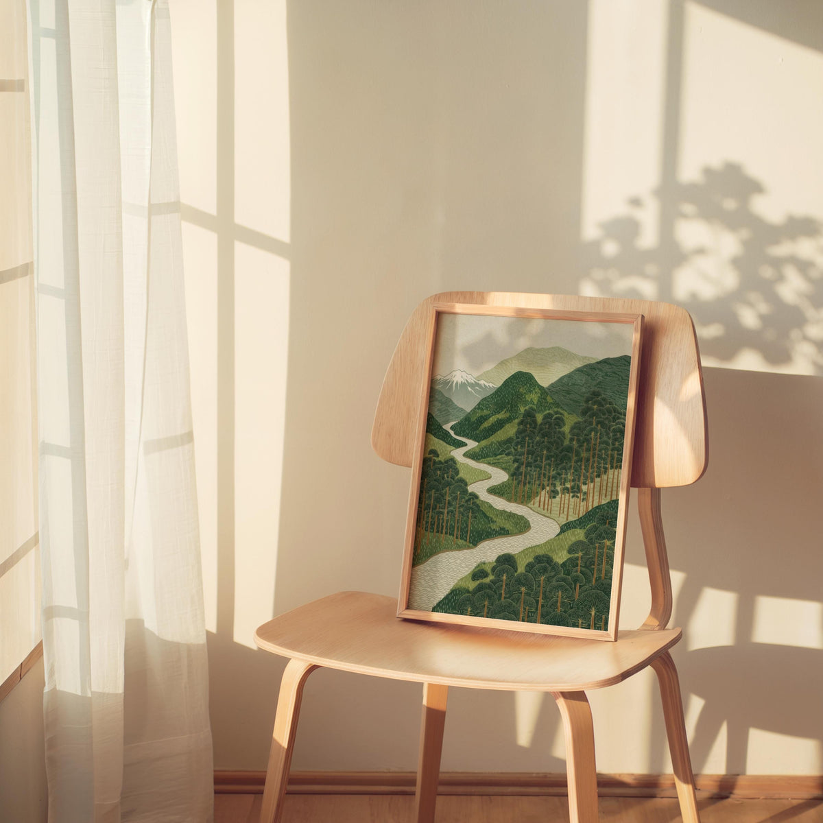 Wooden chair by sunlit window holds minimalist Japanese wall art, soft beige and muted green palette