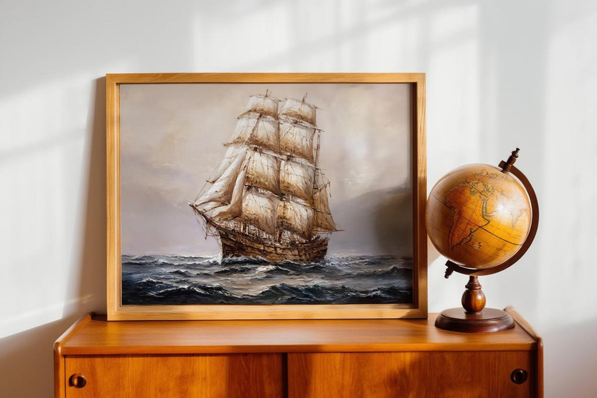 Antique tall ship canvas for nautical wall art; billowing sails on a moody navy blue seascape framed in ornate gold.