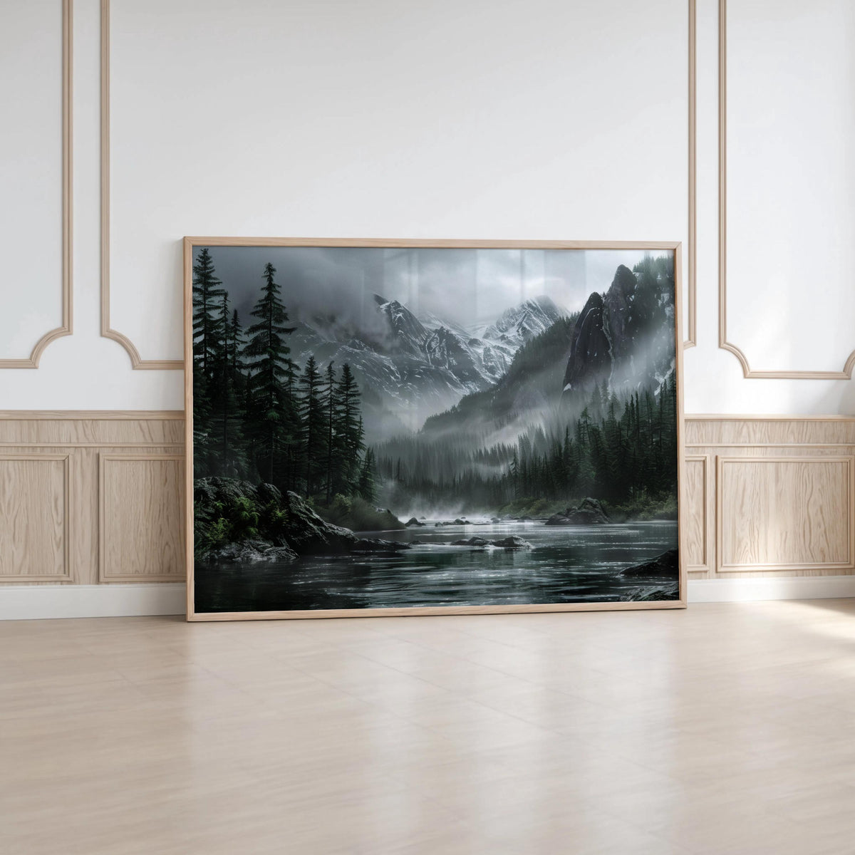 Wide moody mountain landscape wall art resting on floor in minimalist room, neutral earth tone wall art